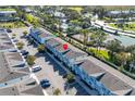 Aerial perspective showcasing community pool and the subject townhome at 7960 Formosa Valley Pl, Kissimmee, FL 34747