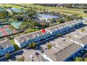 Wide aerial view of townhome community, highlighting location and landscape at 7960 Formosa Valley Pl, Kissimmee, FL 34747