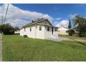 House with side yard, freshly painted exterior at 828 Willie Mays Pkwy, Orlando, FL 32811