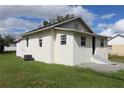House with side yard, freshly painted exterior at 828 Willie Mays Pkwy, Orlando, FL 32811