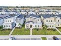 Aerial view of modern homes in a residential community at 730 Drop Shot Dr, Davenport, FL 33896