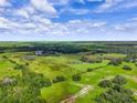 Wide aerial view of expansive green pastures and trees at 350 S 5Th St, Orlando, FL 32833