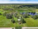 Aerial view of a rural property with a house and surrounding land at 350 S 5Th St, Orlando, FL 32833