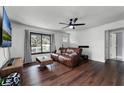 Living room with leather couch and dark hardwood floors at 2935 Aein Rd, Orlando, FL 32817