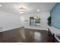 Open living area with new flooring and an accent wall at 1213 Baranova Rd, Ocoee, FL 34761