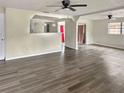 Living room features wood-look flooring and ceiling fan at 1904 Historic Goldsboro Blvd, Sanford, FL 32771