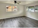 Bright living room with large windows and wood-look flooring at 1904 Historic Goldsboro Blvd, Sanford, FL 32771