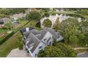 House near a lake with a backyard and pool at 2523 Madron Ct, Orlando, FL 32806
