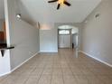 Spacious living room with tile flooring and neutral wall colors at 817 Highland Crest Loop, Lake Wales, FL 33853