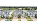 Three townhouses next to a golf course at 543 Ocean Course Ave, Davenport, FL 33896