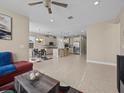 Open concept kitchen with an island, stainless steel appliances and granite countertops at 528 Bellissimo Pl, Howey In The Hills, FL 34737