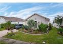 Two-car driveway and well-maintained landscaping at 1150 N Hampton Dr, Davenport, FL 33897