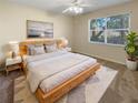 Bright bedroom with large window and light colored walls at 1711 Shadow View Cir # 1711, Maitland, FL 32751