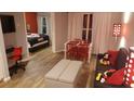 Open concept living area with Mickey Mouse decor and dining space at 3100 Parkway Blvd # 748, Kissimmee, FL 34747