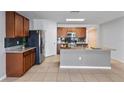 Modern kitchen with stainless steel appliances and granite countertops at 356 Nova Dr, Davenport, FL 33837