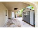 Covered patio with storage shed in backyard at 180 N Lakewood Cir, Maitland, FL 32751