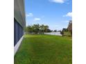 Backyard with view of lake and fenced area at 793 E Birchwood Cir, Kissimmee, FL 34743