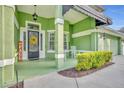 Front porch with rocking chair and seasonal decor at 3136 Heartleaf Pl, Winter Park, FL 32792