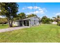 House exterior showcasing a carport and well-maintained lawn at 30 Seminole Dr, Debary, FL 32713