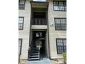 Apartment building entrance with stairs at 4647 Cason Cove Dr # 2425, Orlando, FL 32811