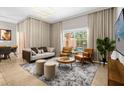 Spacious living room with comfortable seating and large windows at 2955 Banana Palm Dr, Kissimmee, FL 34747