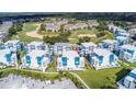 Aerial view showing a townhouse community near a golf course at 7740 Sandy Ridge Dr # 218, Reunion, FL 34747