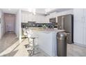 Bright kitchen featuring stainless steel appliances and an island at 3191 Paradox Cir # 406, Kissimmee, FL 34746