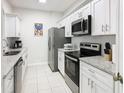 Modern kitchen with stainless steel appliances and granite countertops at 2809 Almaton Loop # 304, Kissimmee, FL 34747