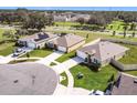 Aerial view of a residential neighborhood with houses and green spaces at 3997 Magenta Pl, Saint Cloud, FL 34772