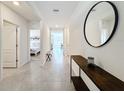 Bright and spacious foyer with tile flooring, leading to other rooms at 3997 Magenta Pl, Saint Cloud, FL 34772