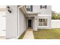 Front entry of the house with a walkway at 759 Lakeview Pointe Dr, Clermont, FL 34711