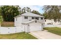 Two story house with a double garage and fenced backyard at 759 Lakeview Pointe Dr, Clermont, FL 34711