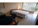 Comfortable bedroom with double bed, dining table and access to balcony at 7900 S Orange Blossom Trl # 2053, Orlando, FL 32809