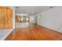 Large living room with hardwood floors and brick wall at 447-441 N Lincoln St, Daytona Beach, FL 32114