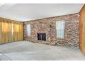 Spacious living room with hardwood floors and brick fireplace at 447-441 N Lincoln St, Daytona Beach, FL 32114