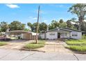 Front view of a brick house with a carport at 447-441 N Lincoln St, Daytona Beach, FL 32114