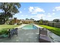 Inviting backyard pool with patio furniture at 1004 Wildwood E, Lakeland, FL 33801