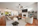 Living room with a fireplace and built-in shelving at 2182 Bent Oak Dr, Apopka, FL 32712