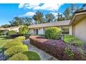 House exterior showcasing a well-maintained lawn and landscaping at 734 Riverbend Blvd, Longwood, FL 32779