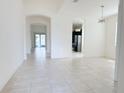 Bright, spacious living room with tile floors and open floor plan at 3995 Scarlet Branch Rd, Orlando, FL 32824