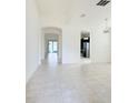 Bright, spacious living room with tile floors and open floor plan at 3995 Scarlet Branch Rd, Orlando, FL 32824