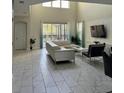Spacious living area with large sectional sofa and pool view at 2813 Bookmark Dr, Kissimmee, FL 34746