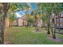 Landscaped community with picnic tables and trees at 6332 Raleigh St # 903, Orlando, FL 32835