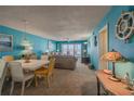 Beachfront living room with dining area and ocean view at 5501 S Atlantic Ave # 307, New Smyrna Beach, FL 32169