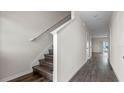 Modern staircase in a light and bright hallway at 1234 Balsam Dr, Davenport, FL 33837