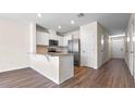 Kitchen with white cabinets, granite counters at 1230 Balsam Dr, Davenport, FL 33837