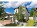 Two-story house with landscaped yard and driveway at 5443 Carrara Ct, St Cloud, FL 34771