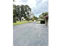 Asphalt road with mature trees on both sides at 4229 S Lake Orlando Pkwy # 133, Orlando, FL 32808