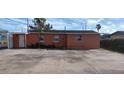 Rear view of the house, showing a large concrete area at 1318 S Semoran Blvd, Orlando, FL 32807