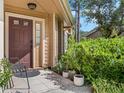 Inviting front entry with a charming porch at 7269 Dr Phillips Blvd, Orlando, FL 32819